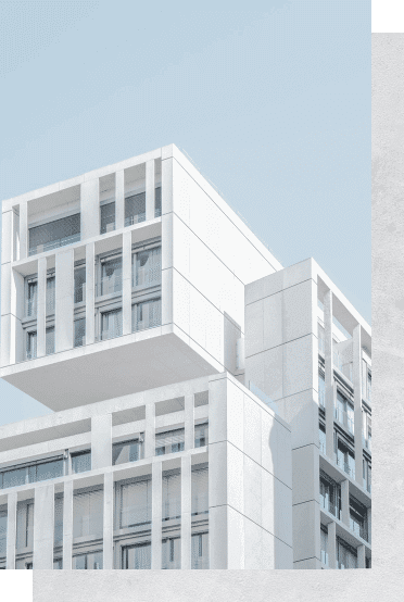 white modern cement building under blue sky