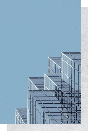 white and blue concrete building under blue sky during daytime